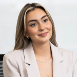 Woman smiling at the camera.